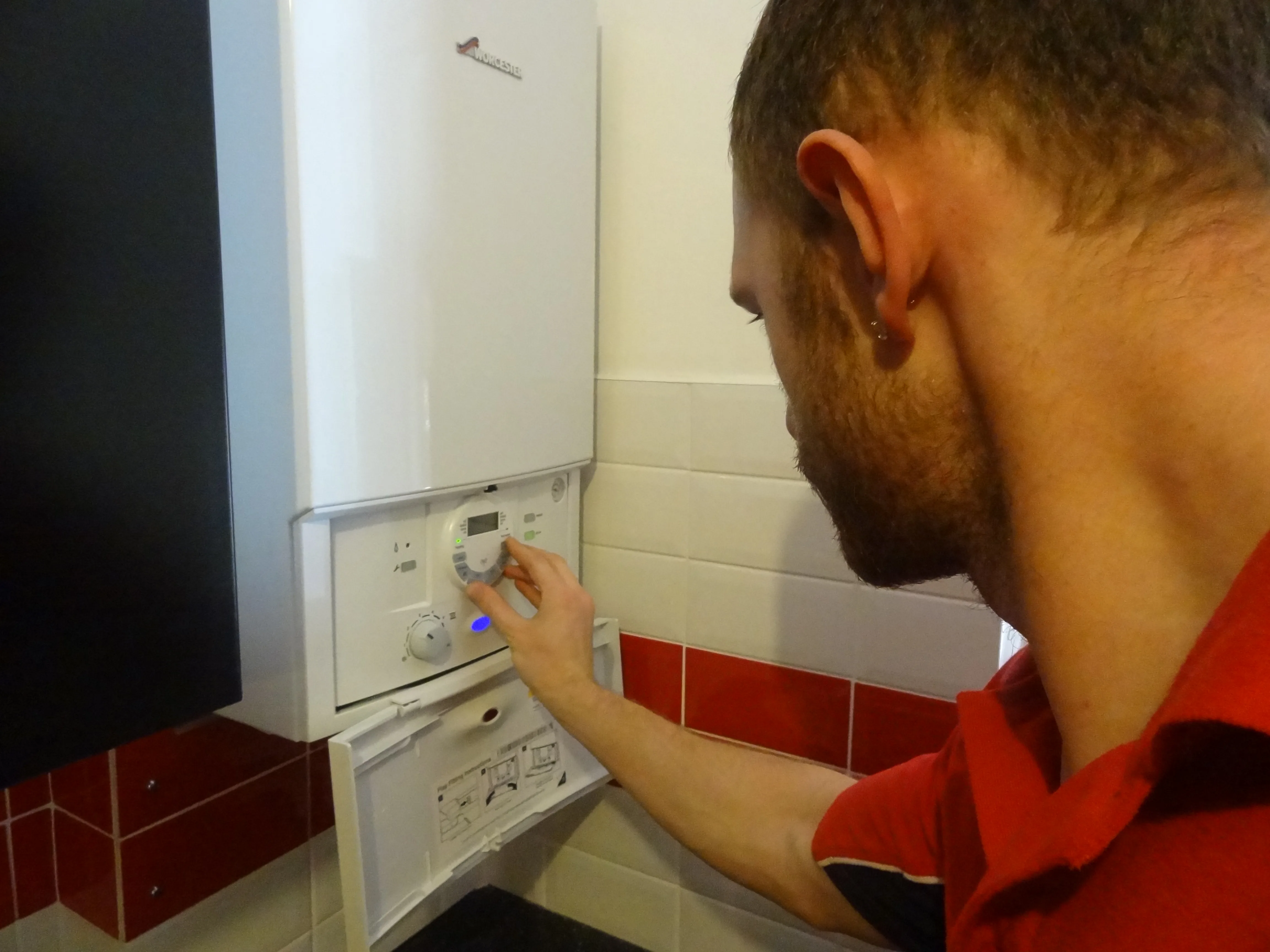 Kingston Plumbers 247 engineer working on a boiler installation in Kingston upon Thames